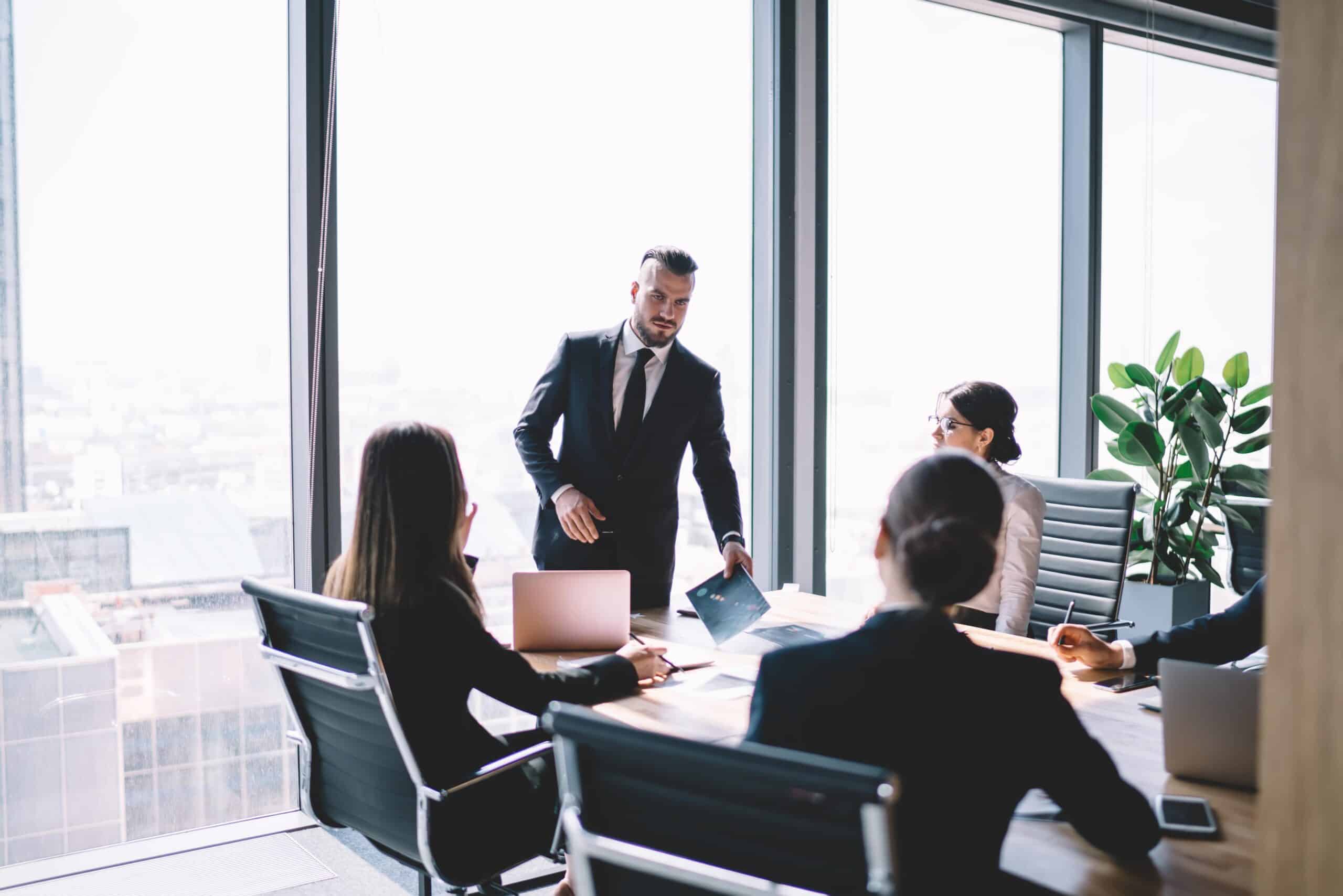 New Hire COO Executive Running Meeting in Upscale Office