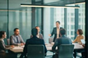 Corporate leadership team seated in a glass-walled conference room evaluating executive search services during a board presentation.